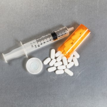 Pills and a syringe